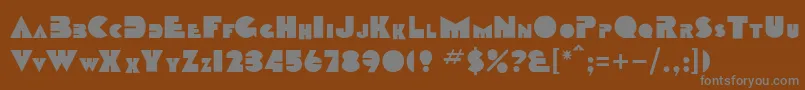 SharktoothNormal-fontti – harmaat kirjasimet ruskealla taustalla