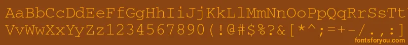 フォントCourierdosctt – オレンジ色の文字が茶色の背景にあります。