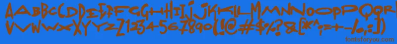 Czcionka Madjumbles – brązowe czcionki na niebieskim tle