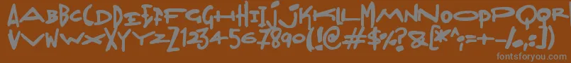 Madjumbles-fontti – harmaat kirjasimet ruskealla taustalla