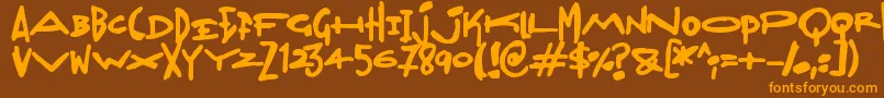 フォントMadjumbles – オレンジ色の文字が茶色の背景にあります。