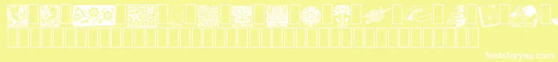 ListemagerensDingbats-fontti – valkoiset fontit keltaisella taustalla