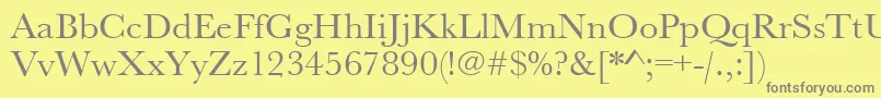 フォントUrwbaskertwid – 黄色の背景に灰色の文字