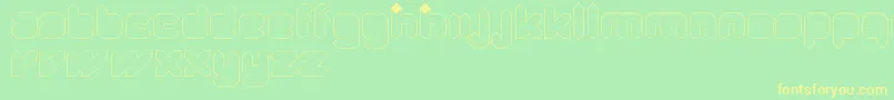 フォントQuadLight – 黄色の文字が緑の背景にあります