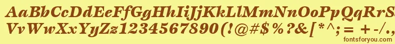 フォントItcEspritLtBlackItalic – 茶色の文字が黄色の背景にあります。