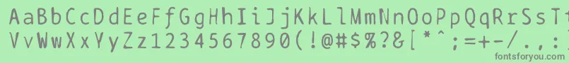 フォントBptypewritedamaged – 緑の背景に灰色の文字