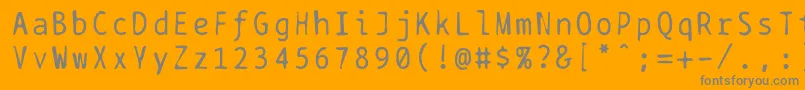 フォントBptypewritedamaged – オレンジの背景に灰色の文字