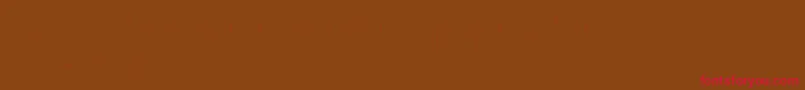 Czcionka Clowningaround – czerwone czcionki na brązowym tle