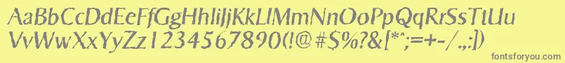 SigvarrandomItalic-fontti – harmaat kirjasimet keltaisella taustalla