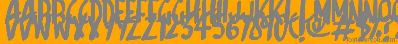 Sketchalot-fontti – harmaat kirjasimet oranssilla taustalla
