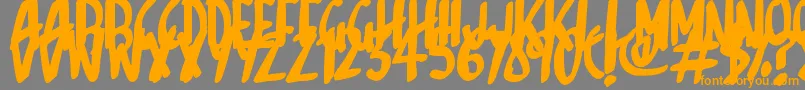 フォントSketchalot – オレンジの文字は灰色の背景にあります。