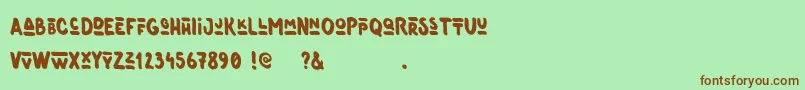 Czcionka Oneer – brązowe czcionki na zielonym tle