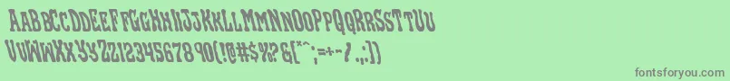 フォントBlackgunkleft – 緑の背景に灰色の文字