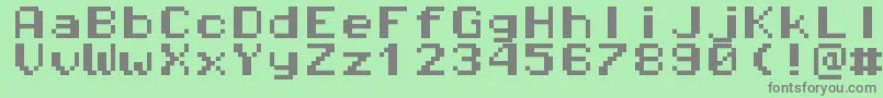 フォントPixeloperatormonohb8 – 緑の背景に灰色の文字