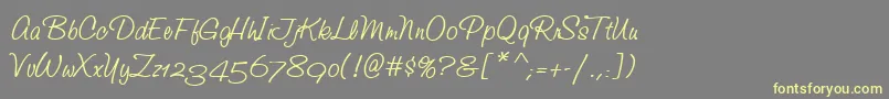 StudioScriptAltItcTt-Schriftart – Gelbe Schriften auf grauem Hintergrund