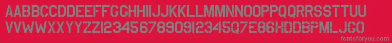 UsaafStencil-Schriftart – Graue Schriften auf rotem Hintergrund