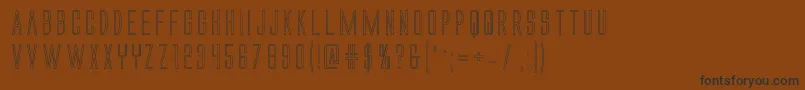 Alienleagueout Font – Black Fonts on Brown Background