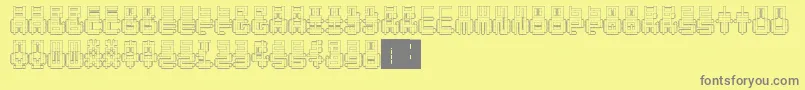 PunchedOut-fontti – harmaat kirjasimet keltaisella taustalla