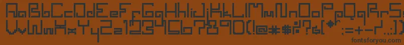 Czcionka SpacewormErc2006 – czarne czcionki na brązowym tle