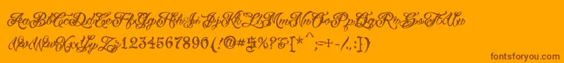 VtcTattooscripttwo-Schriftart – Braune Schriften auf orangefarbenem Hintergrund