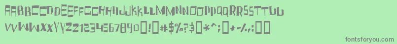 フォントFruidc – 緑の背景に灰色の文字