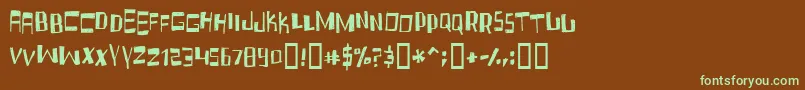 フォントFruidc – 緑色の文字が茶色の背景にあります。