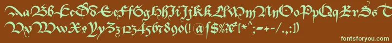 フォントBastardaK – 緑色の文字が茶色の背景にあります。