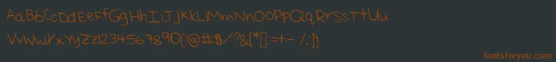 Шрифт ReisHandwritingThin – коричневые шрифты на чёрном фоне