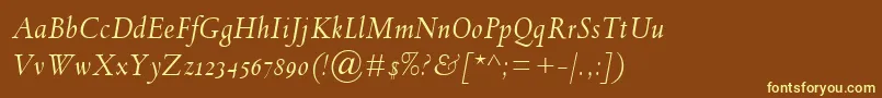 SpectrumMtOsfItalic-fontti – keltaiset fontit ruskealla taustalla