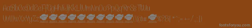 CanelettersansthinPersonaluse-Schriftart – Graue Schriften auf braunem Hintergrund