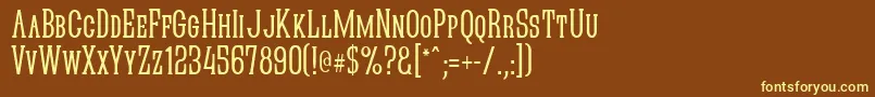 Quasikn-fontti – keltaiset fontit ruskealla taustalla