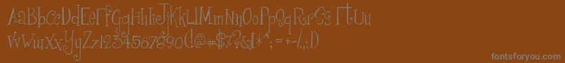 フォントGirlw – 茶色の背景に灰色の文字