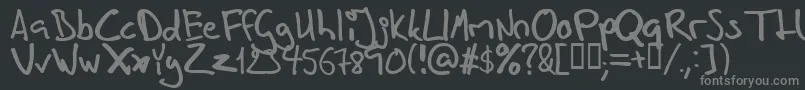 Inhishan-fontti – harmaat kirjasimet mustalla taustalla