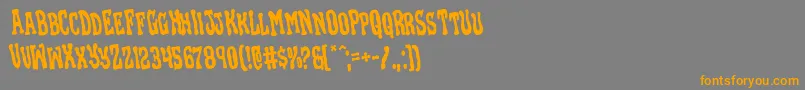 Blackgunkrotate-Schriftart – Orangefarbene Schriften auf grauem Hintergrund