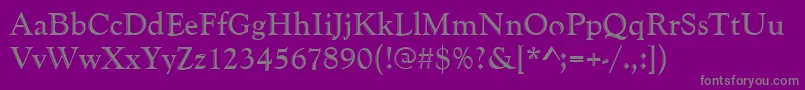 Goudyhand-fontti – harmaat kirjasimet violetilla taustalla