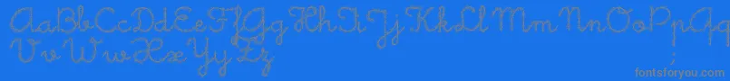 フォントLittleDaisy – 青い背景に灰色の文字
