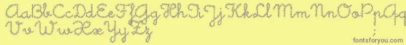 LittleDaisy-Schriftart – Graue Schriften auf gelbem Hintergrund