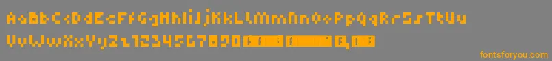 フォントDupix – オレンジの文字は灰色の背景にあります。