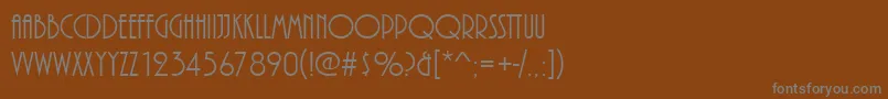 Plazadreg-Schriftart – Graue Schriften auf braunem Hintergrund