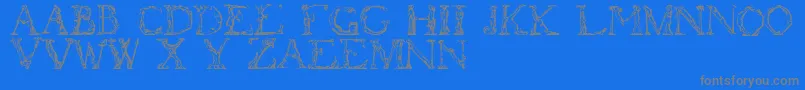 Flotner-fontti – harmaat kirjasimet sinisellä taustalla