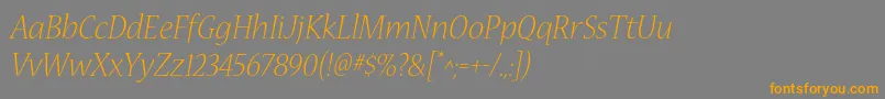 フォントNuevastdLightitalic – オレンジの文字は灰色の背景にあります。