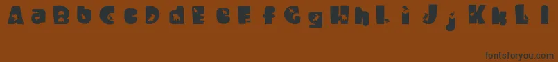 WaltzingMatilda Font – Black Fonts on Brown Background