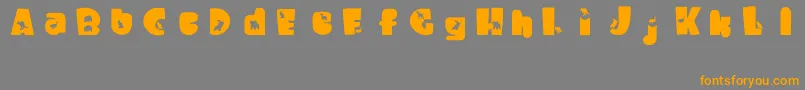 フォントWaltzingMatilda – オレンジの文字は灰色の背景にあります。