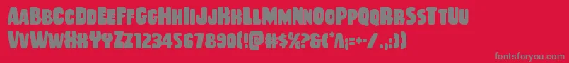 フォントRubberboycond – 赤い背景に灰色の文字