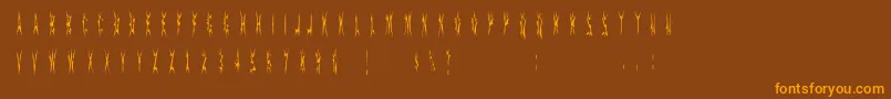 フォントSidthespider – オレンジ色の文字が茶色の背景にあります。
