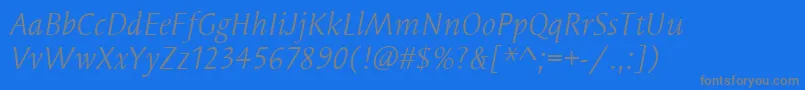 SyndorItcBookItalic-Schriftart – Graue Schriften auf blauem Hintergrund
