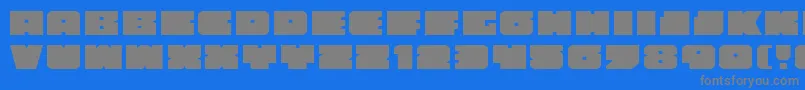 AnakefkaExpanded-fontti – harmaat kirjasimet sinisellä taustalla