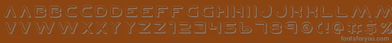 PlanetNShadow-fontti – harmaat kirjasimet ruskealla taustalla
