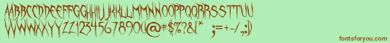 UnquietSpirits-Schriftart – Braune Schriften auf grünem Hintergrund