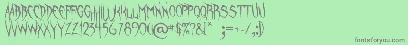 UnquietSpirits Font – Gray Fonts on Green Background